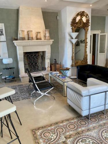 a living room with a couch and a fireplace at Boutique Hotel Masseria Sottomasi in Savelletri di Fasano