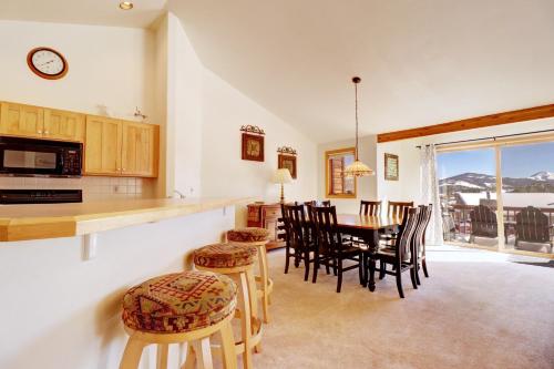 a kitchen and dining room with a table and chairs at 172 Sauterne Sanctuary Townhouse in Silverthorne