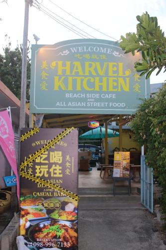a sign for a chinese restaurant with a sign for a food at Grandblue HARVELKITICHEN in Tokashiki