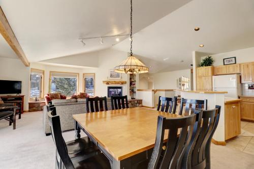 a kitchen and dining room with a wooden table and chairs at 172 Sauterne Sanctuary Townhouse in Silverthorne