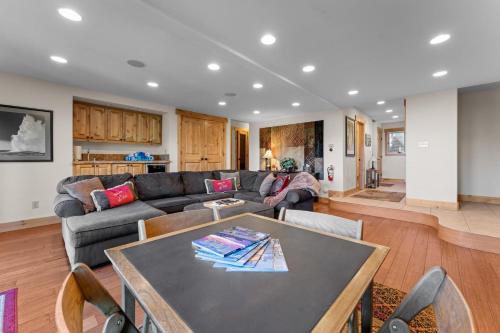 a living room with a couch and a table at Luxury Lakeview Retreat - Hot Tub, SUP, Sauna & More! in Carnelian Bay