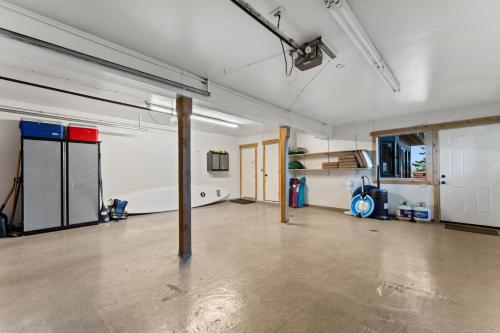an empty garage with a pole in the middle of it at Luxury Lakeview Retreat - Hot Tub, SUP, Sauna & More! in Carnelian Bay