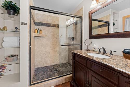 a bathroom with a shower and a sink at Luxury Lakeview Retreat - Hot Tub, SUP, Sauna & More! in Carnelian Bay