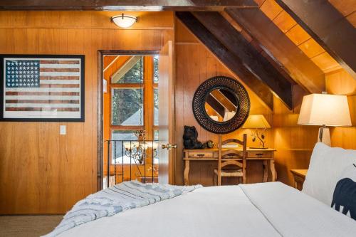 a bedroom with an american flag on the wall at Honey Bear Cabin in Carnelian Bay
