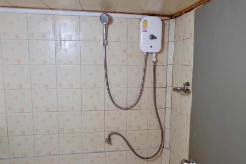 a shower in a bathroom with a shower head at The Resort Angel Hill in Ban Khlong Phai