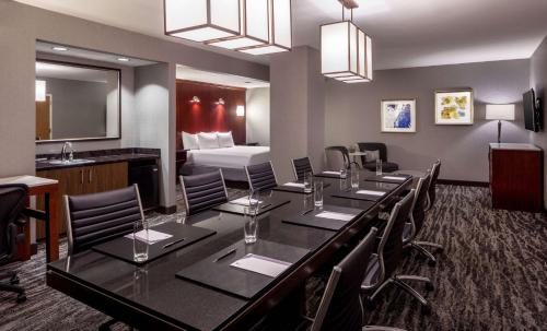 a conference room with a long table and chairs at Hyatt Regency Saint Louis at The Arch in Saint Louis
