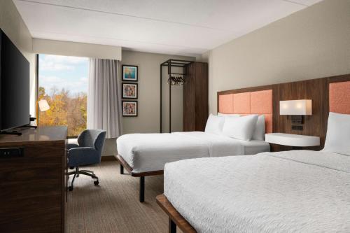 Ένα ή περισσότερα κρεβάτια σε δωμάτιο στο Hampton Inn Norfolk/Virginia Beach