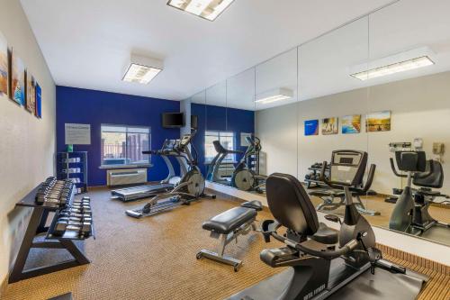a gym with several exercise bikes and a mirror at Comfort Inn & Suites Mexia in Mexia