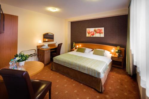 Кровать или кровати в номере Hotel Galicya