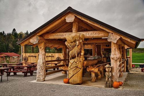 a log cabin with pumpkins in front of it at Cowboy's Land in Višnja Gora