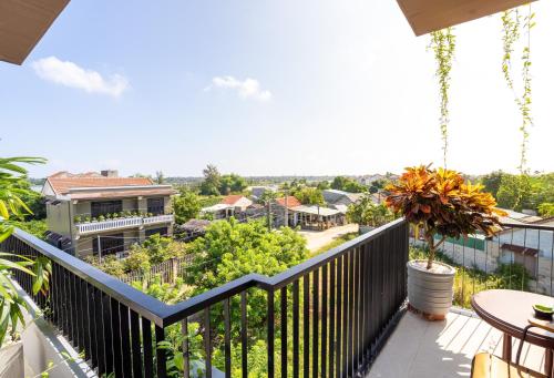 a balcony with a view of a town at Ancient River Villa in Hoi An