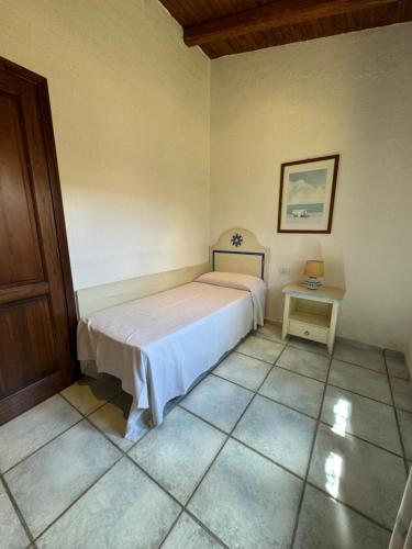 Postel nebo postele na pokoji v ubytování Li Suari Club Village