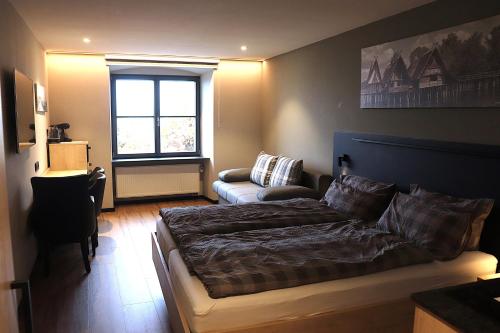 a living room with a bed and a couch at Alte Molke in Meersburg