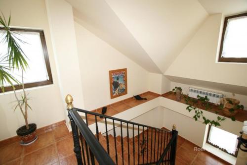 an attic room with a staircase and a stair case at El Pradón in Mar