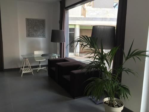 a living room with a couch and a table at La Perla in Almería