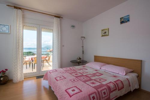 Postel nebo postele na pokoji v ubytování Apartments Marina