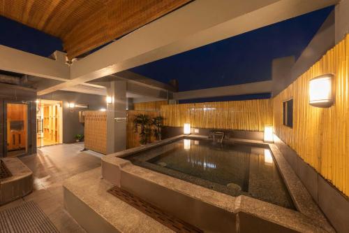 a large bathroom with a large bathtub in the middle at Azumaya Kim Mã 3 in Hanoi