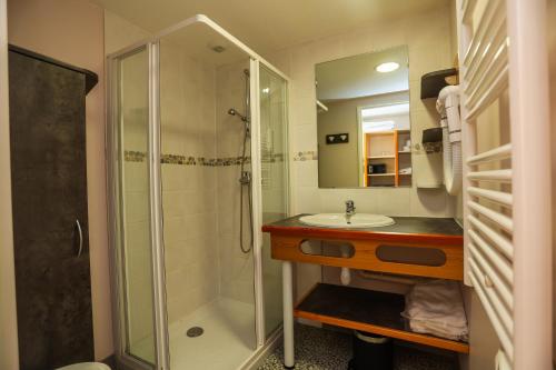 a bathroom with a shower and a sink at Village Club Les Hyvans in Chorges
