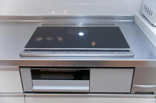 a laptop computer sitting on top of a shelf at Miraie Awaji Kuruma95 in Awaji