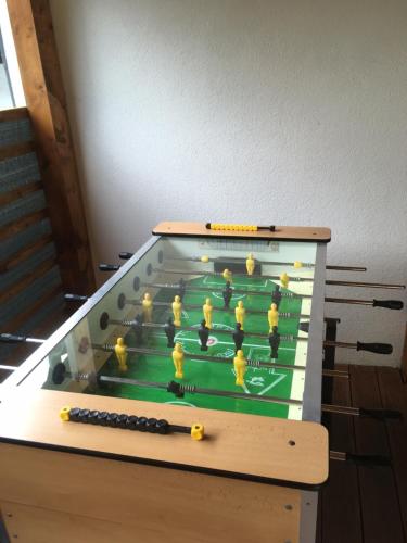 a foosball table with a group of people on it at Resort Biela Skala - CHATA Chopok Jasná Juh in Bystrá