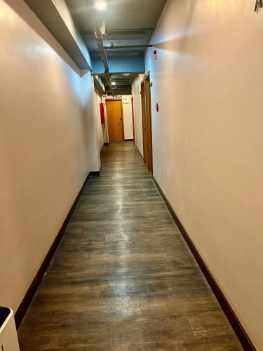 a hallway in an office building with a long corridor at Cuna Hotel in El Nido