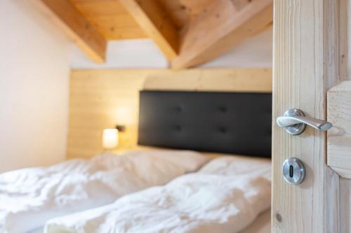 Ένα ή περισσότερα κρεβάτια σε δωμάτιο στο Apartment Vajolet