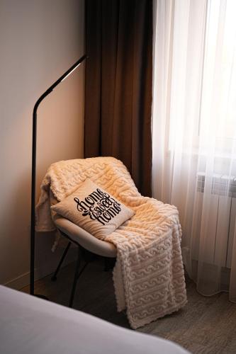 a reflection of a bed in a mirror at Sweet Home Apart-Hotel in Yerevan