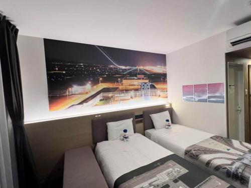 Cama ou camas em um quarto em Henn na Resort & Spa Kansai Airport - former Henn na Hotel Kansai Airport