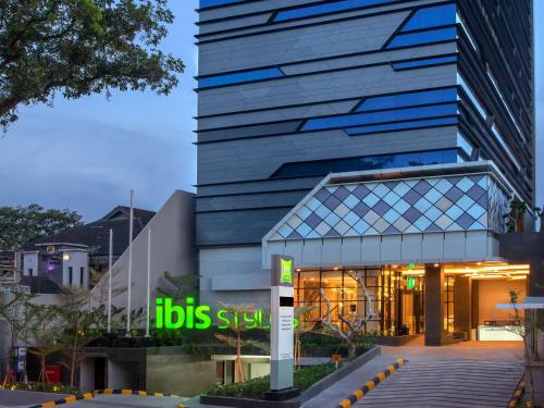 a building with a ups sign in front of it at ibis Styles Medan Pattimura in Medan