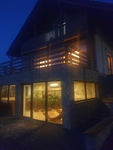 a building at night with its lights on at wellness Chata u Pinkasů in Písečná