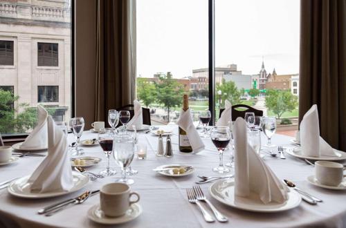 a table with glasses and napkins and a bottle of wine at Jefferson Street Inn in Wausau