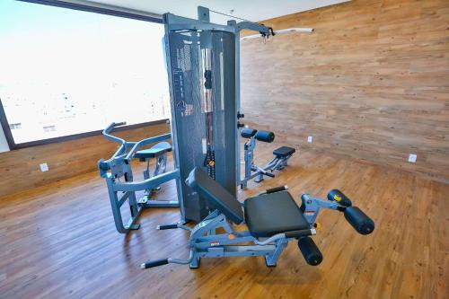 a gym with two exercise bikes in a room at Radisson RED Campinas in Campinas