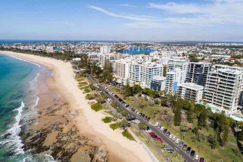an aerial view of a beach and buildings at First Light Mooloolaba, an Ascend Collection Hotel in Mooloolaba