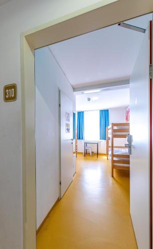 an open door to a hallway with a room at A&T Hotel & Hostel in Vienna
