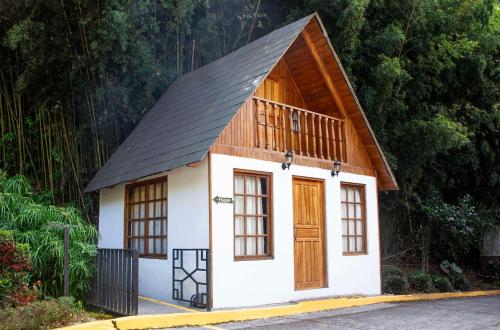 a small house with a black roof at Hotel Bambito By Faranda Boutique, a member of Radisson Individuals in Cerro Punta