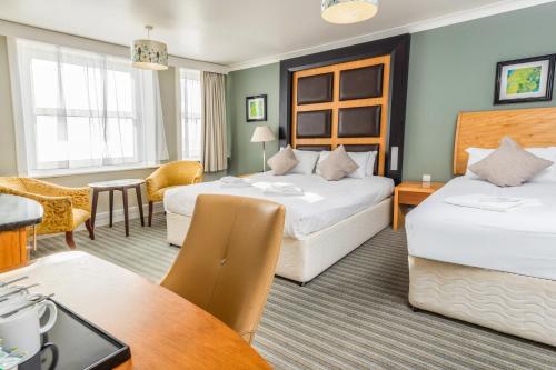 Ένα ή περισσότερα κρεβάτια σε δωμάτιο στο Citrus Hotel Eastbourne by Compass Hospitality