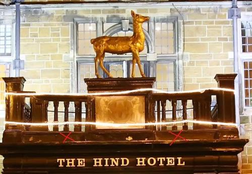 a statue of a horse on top of a building at The Hind Hotel in Wellingborough