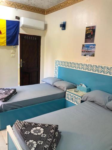 Llit o llits en una habitació de Cattleya Guesthouse