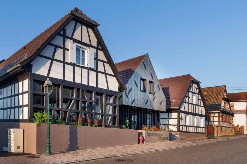 a row of buildings on a street at Résidence Louise in Soultz-sous-Forêts