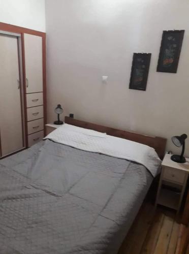 Postel nebo postele na pokoji v ubytování Το πέτρινο σπίτι στην πλατεία