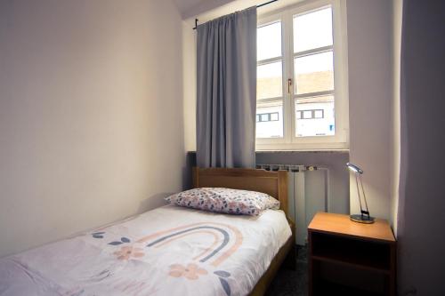 Ένα ή περισσότερα κρεβάτια σε δωμάτιο στο Apartman Rudi
