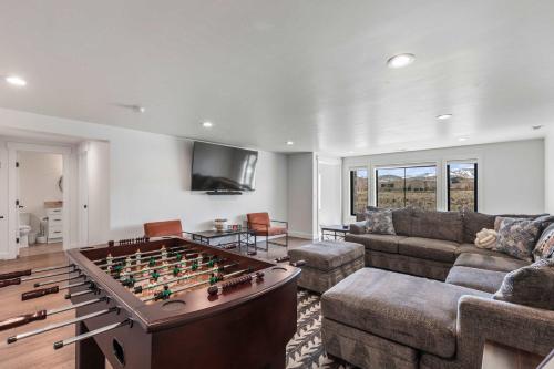a living room with a large foosball table at 6-Bedroom House, Sleeps 25, Tesla Friendly, New Build Near PCMR, Rooftop Spa in Park City