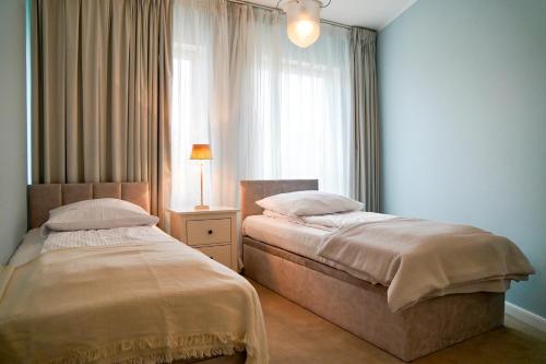 Posteľ alebo postele v izbe v ubytovaní Playa Baltis 9 by Baltic Home