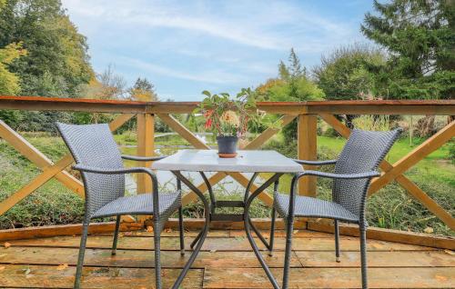 two chairs and a table on a deck at 2 Bedroom Amazing Home In Gueschart in Gueschart