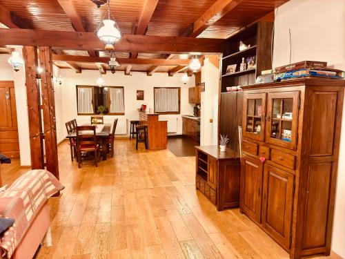 a large living room with a dining room and kitchen at Hillside Praid in Praid