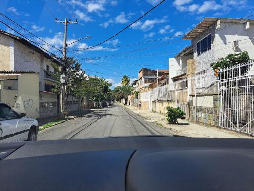 a view from a car of an empty street at Lindo Apto com VAGA no melhor Ilha do Governador in Rio de Janeiro