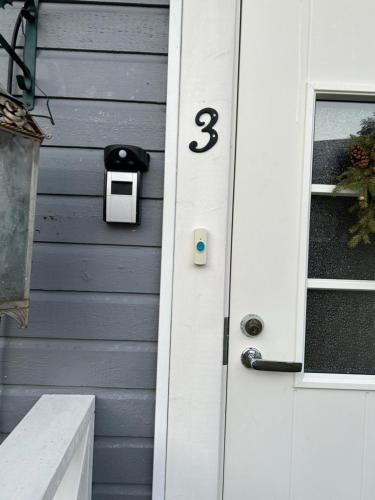 a house with a door with the number three on it at Aurora Center 3 in Rovaniemi