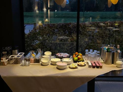 a white table with food and drinks on it at Hotel Restaurant Het Witte Paard in Delden