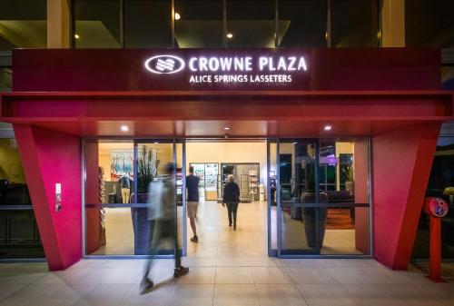 a group of people walking into a shopping mall at Crowne Plaza Alice Springs Lasseters by IHG in Alice Springs