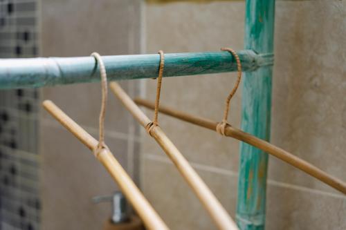 a close up of a blue pole with ropes at The Onion Collective in Ubud